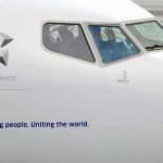 A pilot waves from the flight deck of a United Airlines Boeing 737 Max airplane prior to a flight Dec. 11, 2019, at Renton Municipal Airport in Renton. (AP Photo/Ted S. Warren)
