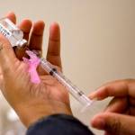 In this 2018 photo, a nurse prepares a flu shot at the Salvation Army in Atlanta. (AP Photo/David Goldman)