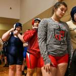 Participants wait to sign up for matches prior to last weeks girls wrestling scramble at Snohomish High School. (Kevin Clark / The Herald)