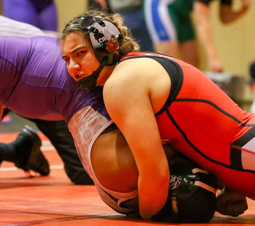 Snohomish&rsquo;s Alycia Pidgeon work to pin Edmonds-Woodway&rsquo;s Destinee Harris during a girls wrestling scramble on Jan. 8, 2020, at Snohomish High School. (Kevin Clark / The Herald)
