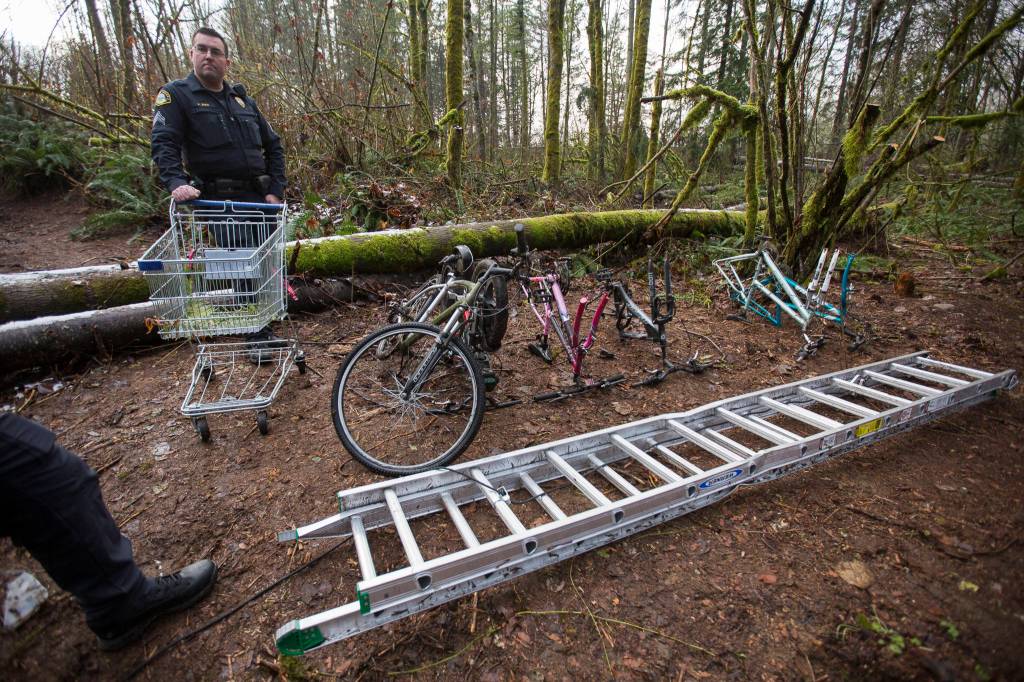 Seg. Paul Ryan stands next to a handful of equipment that was found in and near the dwelling. (Olivia Vanni / The Herald)