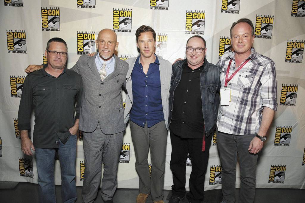 Tom McGrath (far right) poses with colleagues (from left) writer-director Eric Darnell, actors John Malkovich and Benedict Cumberbatch, and director Simon J. Smith at a 2014 event in San Diego. (Associated Press)