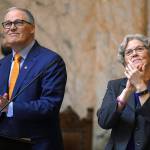 Washington Gov. Jay Inslee, along with new Speaker of the House Laurie Jenkins, applaud gallery introductions before the governors annual State of the State to a joint session of the state Legislature in the House Chambers in Olympia on Tuesday. (Steve Bloom/The Olympian via AP)