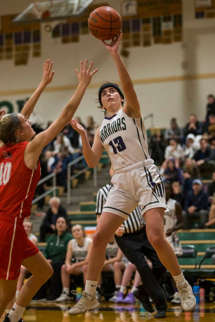 Edmonds-Woodways Jadyn Waram makes a jump shot during the Warriors 44-33 win over Snohomish in a Wesco 3A/2A game Friday in Edmonds. (Olivia Vanni / The Herald).