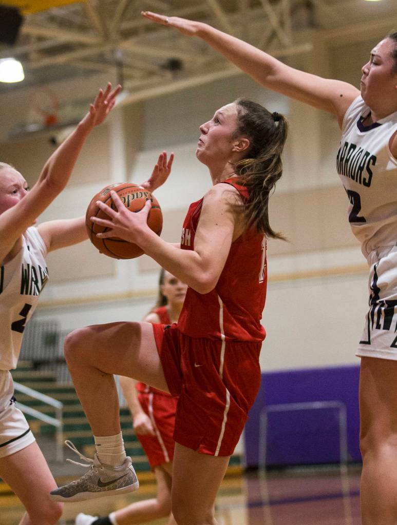 Snohomishs Ella Gallatin drives to the hoop during a Wesco 3A/2A girls basketball game Friday in Edmonds. Edmonds-Woodway beat Gallatin and the Panthers 44-33. (Olivia Vanni / The Herald).