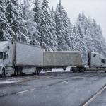 Semitrailer trucks that had been waiting at the U.S. 2 closure turn around on Monday in Gold Bar. The highway was closed indefinitely because of heavy snow accumulation and power lines and trees falling over the road. (Olivia Vanni / The Herald)