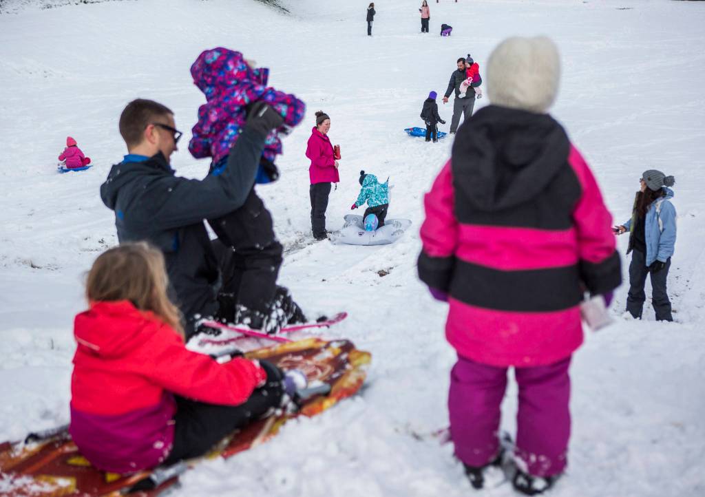 View Ridge-Madison neighborhood residents enjoy the snow Monday in Everett, where school was cancelled. (Olivia Vanni / The Herald)