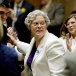 House Speaker Laurie Jinkins, D-Tacoma, is greeted on the floor of the House as she arrives to be sworn in Monday, the first day of the 2020 session of the Washington Legislature at the Capitol in Olympia. (AP Photo/Ted S. Warren)