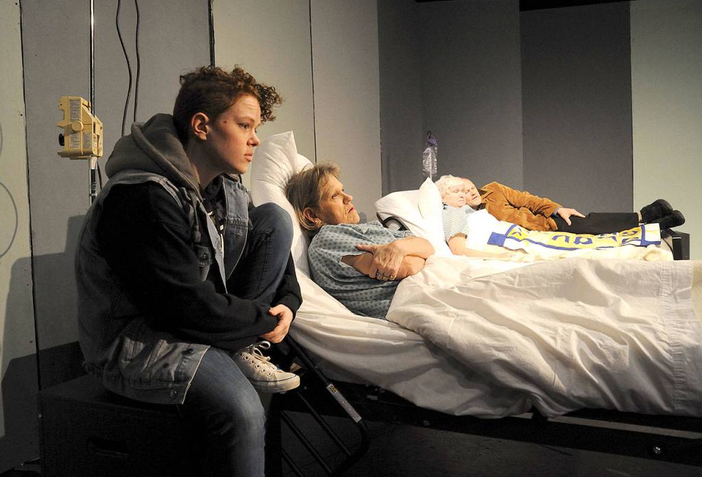 Karla (Bethany Roddy) and Don (David Alan Morrison) keep vigil over their mothers, Marcie (Dawn Cornell) and Geena (Debra Polano). (Larry T. Lisk)