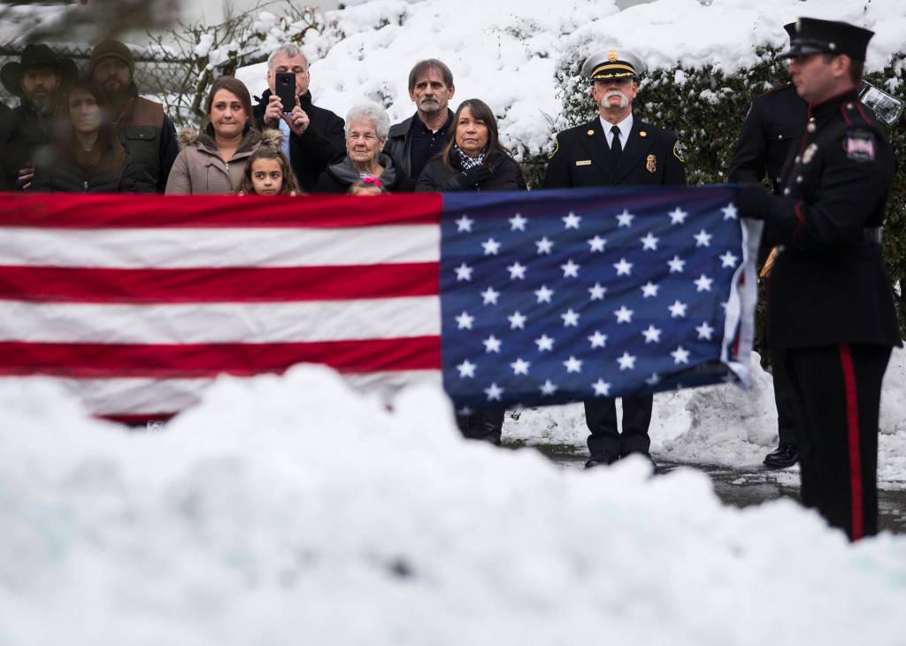 Fire Chief Gary Meek stands with his family during his retirement ceremony on Wednesday at the Clearview station. (Olivia Vanni / The Herald)