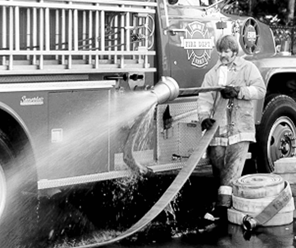 Retiring Fire Chief Gary Meek in his younger days of firefighting. (Submitted photo)
