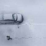 A man walks through fresh snow in downtown Everett on Wednesday. (Olivia Vanni / The Herald)