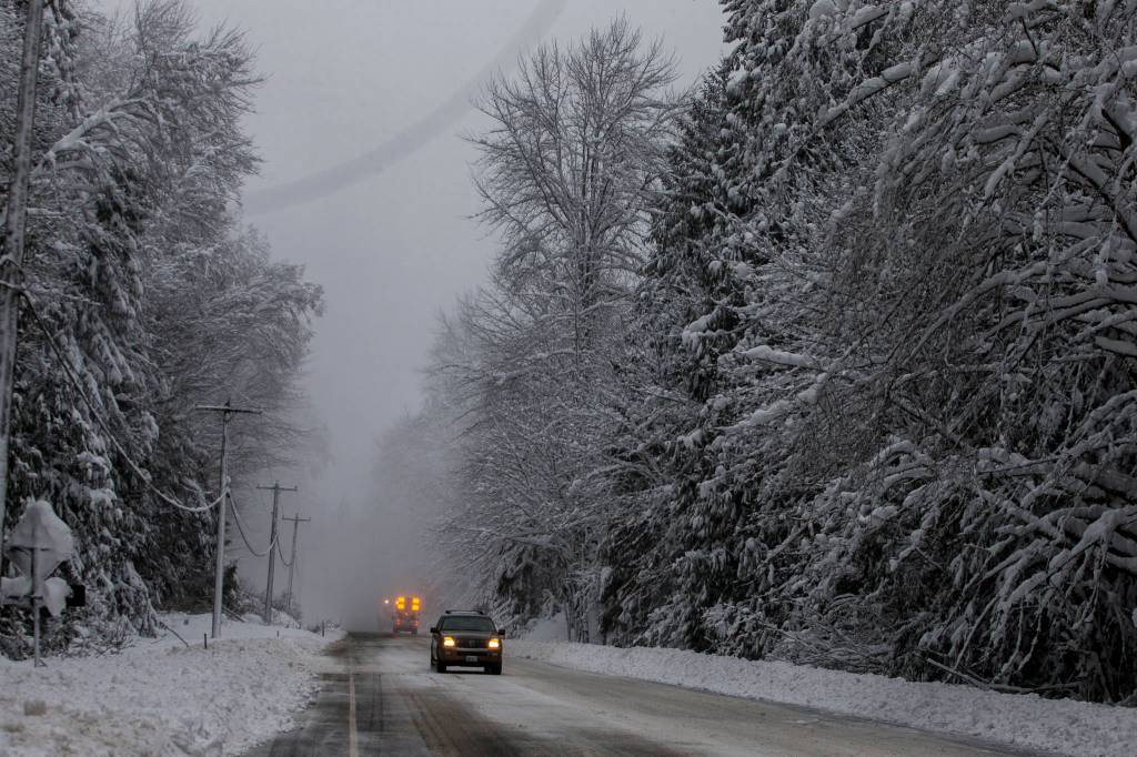 A utility vehicle warns drivers to slow down due to works along US 2 near Baring on Wednesday. (Olivia Vanni / The Herald)