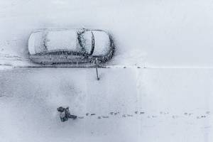 A man walks through fresh snow in downtown Everett on Wednesday, Jan. 15, 2020. (Olivia Vanni / The Herald)