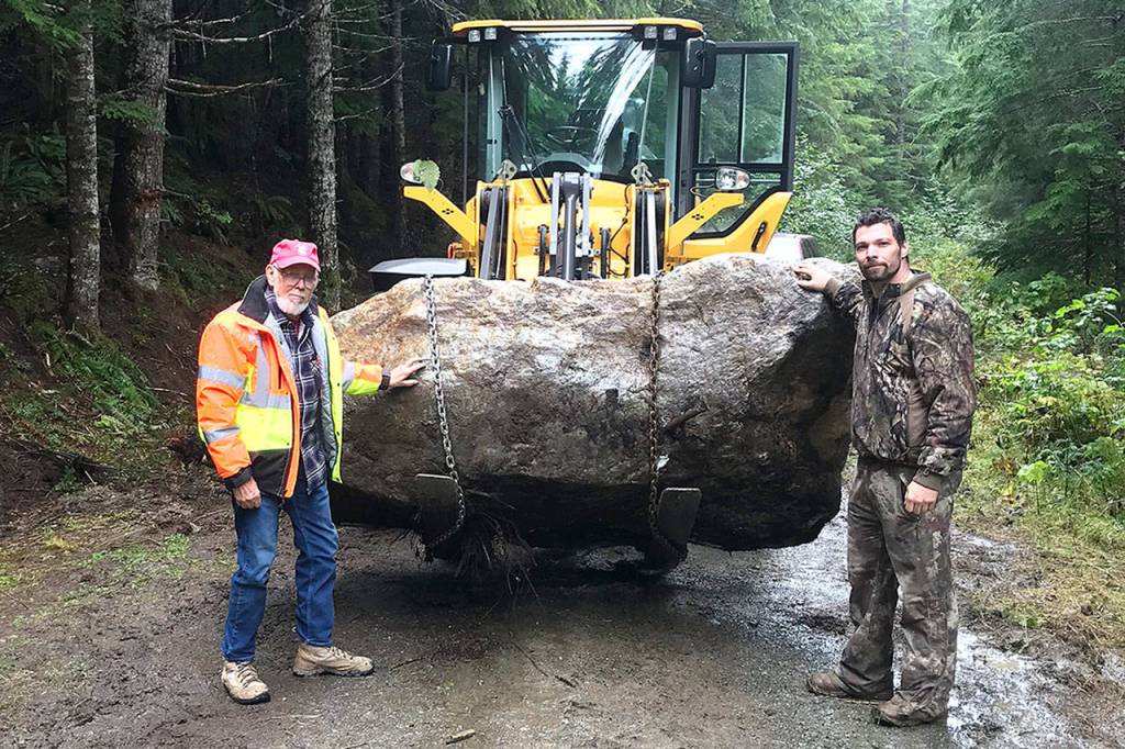 Ed Molsee of Arlington and Jason Henry of Marblemount used a forklift to transport the 8-ton jade boulder from where it was found near Helena Ridge. (Courtesy of Jason Henry)