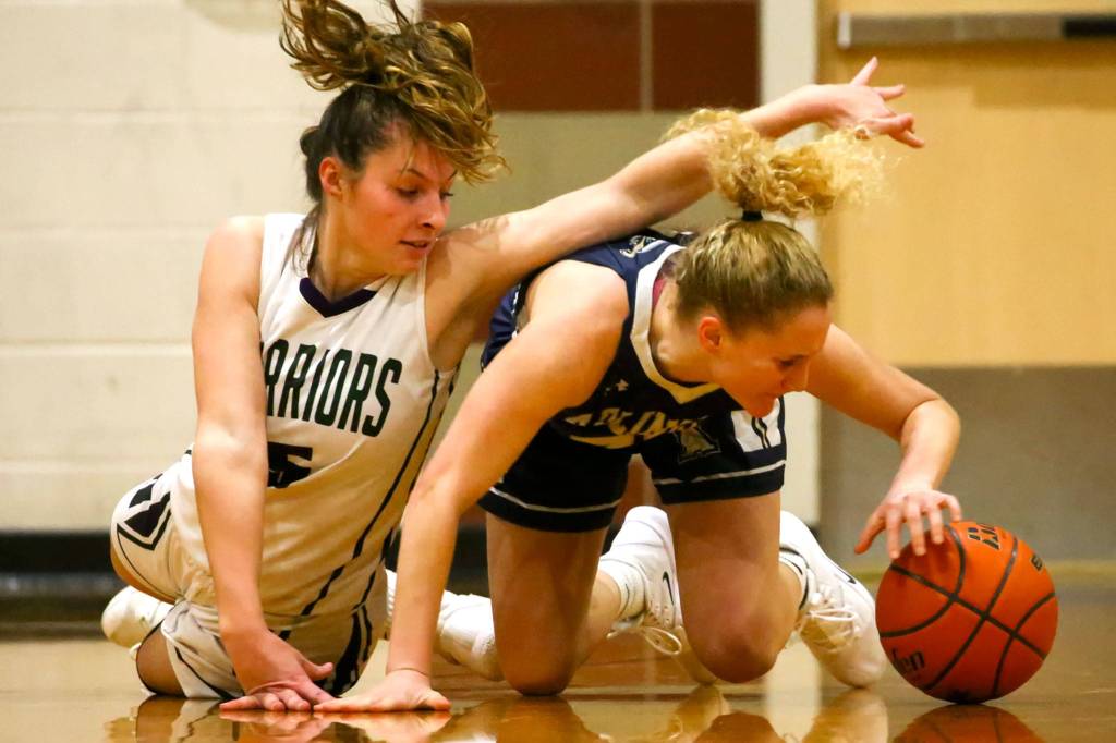 Arlington defeated Edmonds-Woodway 60-34 Thursday evening at Edmonds-Woodway High School on January 16, 2020. (Kevin Clark / The Herald)