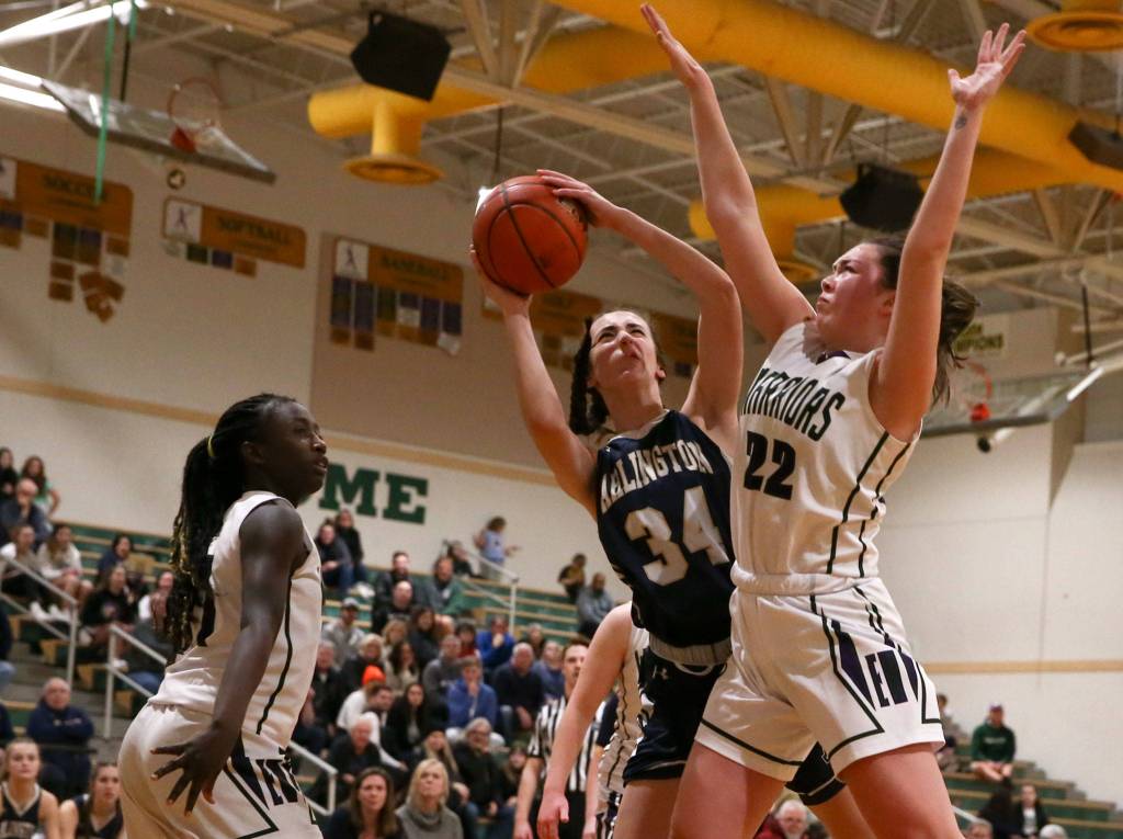 Arlington defeated Edmonds-Woodway 60-34 Thursday evening at Edmonds-Woodway High School on January 16, 2020. (Kevin Clark / The Herald)