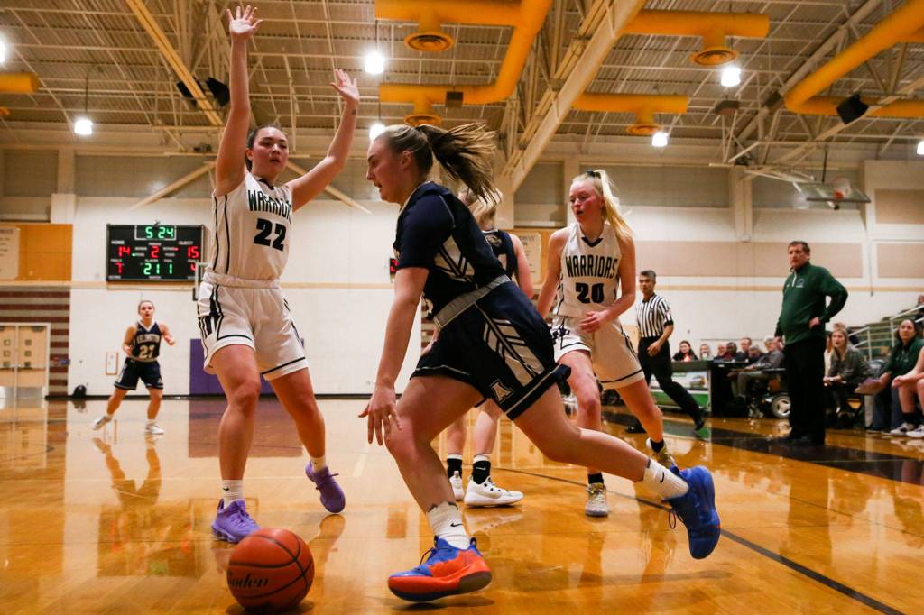 Arlington defeated Edmonds-Woodway 60-34 Thursday evening at Edmonds-Woodway High School on January 16, 2020. (Kevin Clark / The Herald)