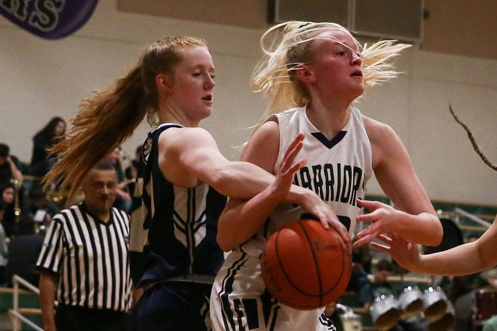 Arlington defeated Edmonds-Woodway 60-34 Thursday evening at Edmonds-Woodway High School on January 16, 2020. (Kevin Clark / The Herald)