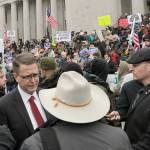 Republican Rep. Matt Shea meets with supporters after speaking at a gun-rights rally in Olympia on Friday. (AP Photo/Rachel La Corte)