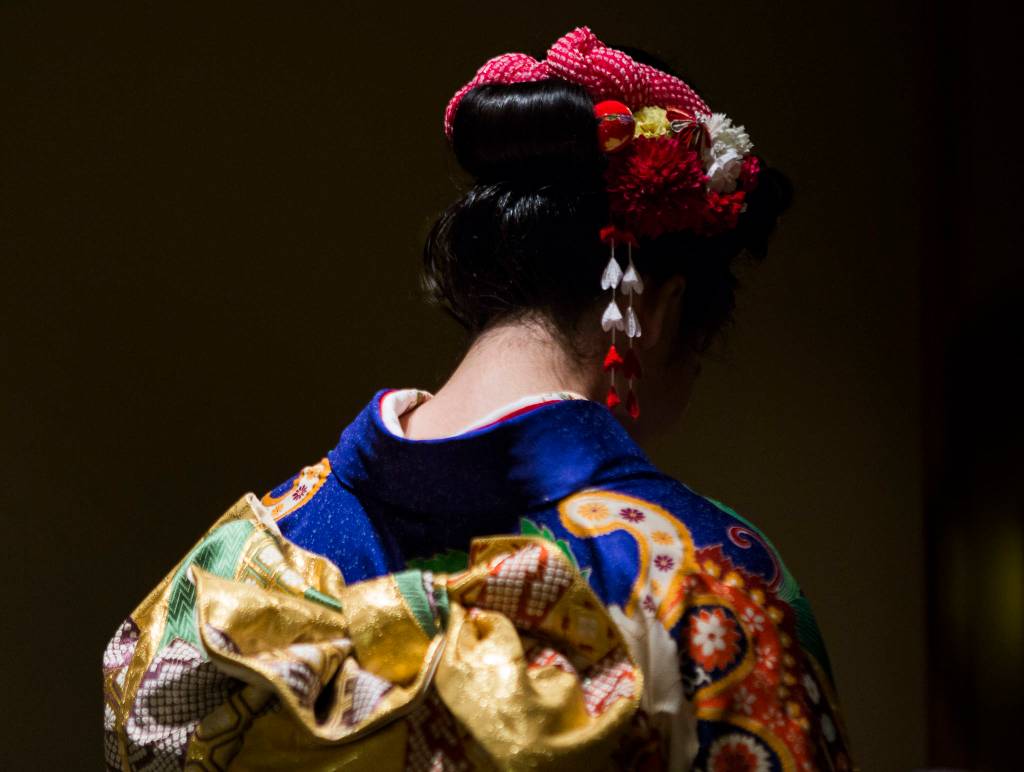 Kotoko Miyamae waits to have her makeup touched up on Jan. 24 in Everett. (Olivia Vanni / The Herald)