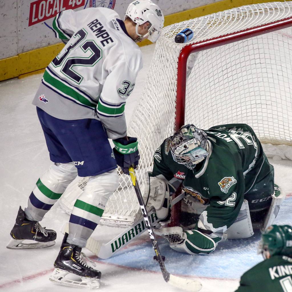 Silvertips Dustin Wolf stops a shot by Seattles Matthew Rempe Sunday evening at the ShoWare Center in Kent. (Kevin Clark / The Herald)