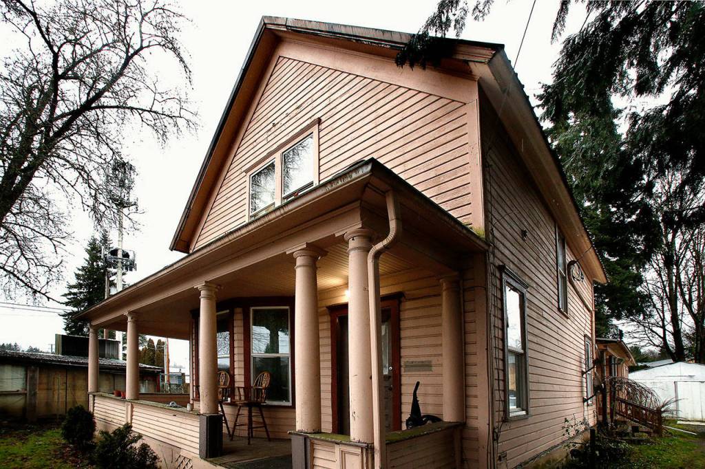 Emanuel Popa owns two adjacent 1903 houses on South Ann Street in Monroe. Theyre the original homes of the family that ran Bucks Shingle Mill, they may be demolished to make way for apartments. Popa is willing to give them away to anyone who wants to pay to move them. (Dan Bates / The Herald)