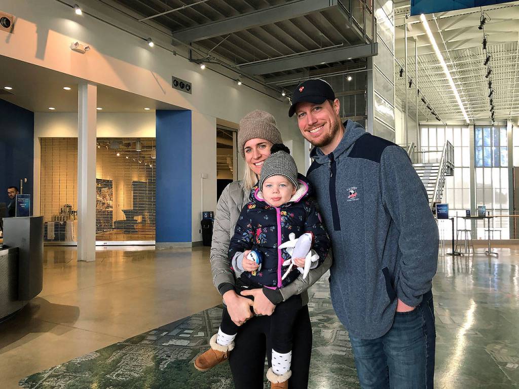 The Fore family from Edmonds  Allison, Vera and Boeing employee Stephen Fore  watched the 777X takeoff from a berm near the Future of Flight. (Janice Podsada / The Herald)