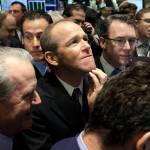 In this 2011 photo, then-Nielsen Company CEO David Calhoun (center) is seen on the floor of the New York Stock Exchange. Calhoun, Boeings new CEO, said Wednesday that production of the 737 Max will resume this spring. (AP Photo/Richard Drew, File)