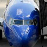 In this 2019 photo, Southwest pilots prepare for a flight at Tampa International Airport in Tampa, Florida. (AP Photo/Mike Stewart, File)