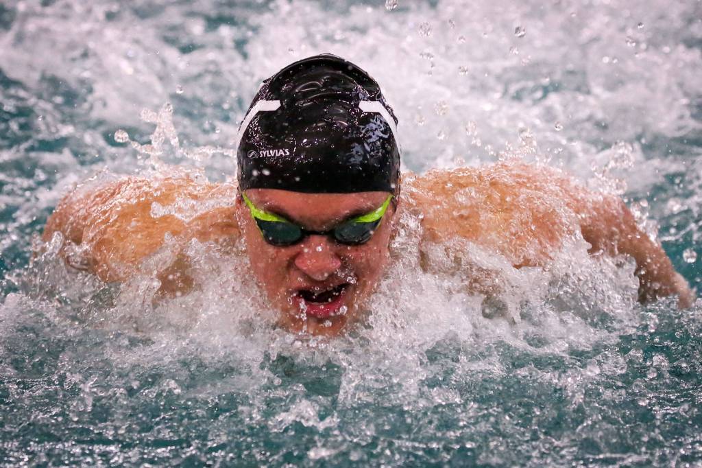 Lake Stevens Alejandro Flores competes in the butterfly leg of the 200-yard medley relay during a Wesco North meet against Snohomish and Glacier Peak on Thursday afternoon at the Snohomish County Aquatic Center. The Vikings won both meets. (Kevin Clark / The Herald)