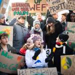 Swedish climate activist Greta Thunberg (center) joins a Fridays for Future demonstration on the final day of the 50th annual meeting of the World Economic Forum, WEF, in Davos, Switzerland on Friday. (Gian Ehrenzeller/Keystone via AP)