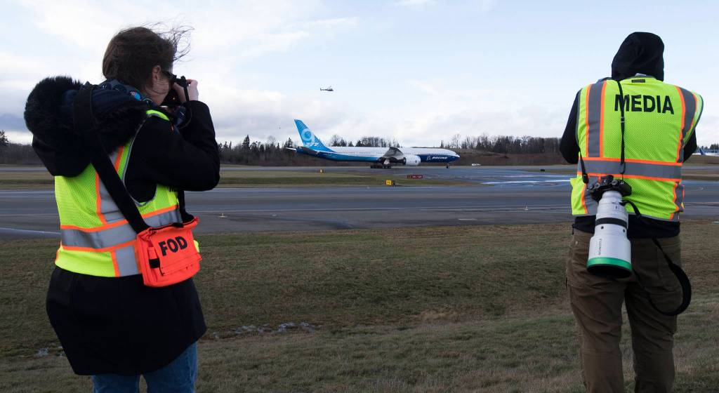 Passing members of the media, Boeings 777x heads back in after heavy winds forced a second cancellation of its first flight at Paine Field on Friday, Jan. 24, 2020 in Everett, Wash. (Andy Bronson / The Herald)