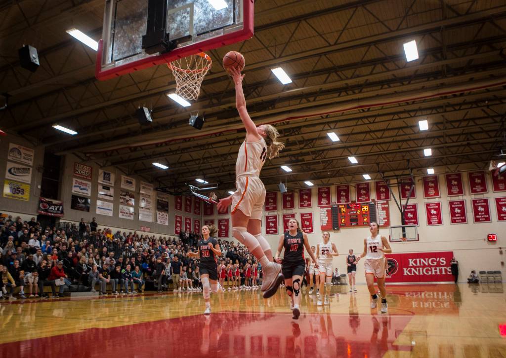 Cashmeres Hailey Van Lith lays the ball in during a game against Kings on Saturday in Shoreline. (Olivia Vanni / The Herald)