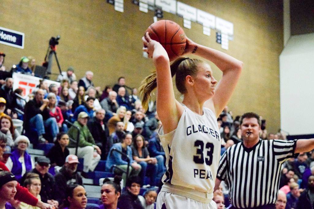 Glacier Peaks Elyse Waldal holds the ball while looking for an open teammate against Lake Stevens on Tuesday, Jan. 28 at Glacier Peak High School in Snohomish. (Katie Webber / The Herald)