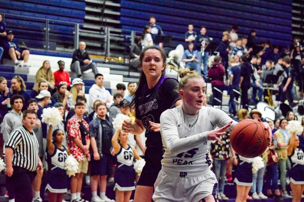 Glacier Peaks Madison Rubino (right) rebounds the ball against Lake Stevens Camille Jentzsch on Tuesday, Jan. 28 at Glacier Peak High School in Snohomish. (Katie Webber / The Herald)