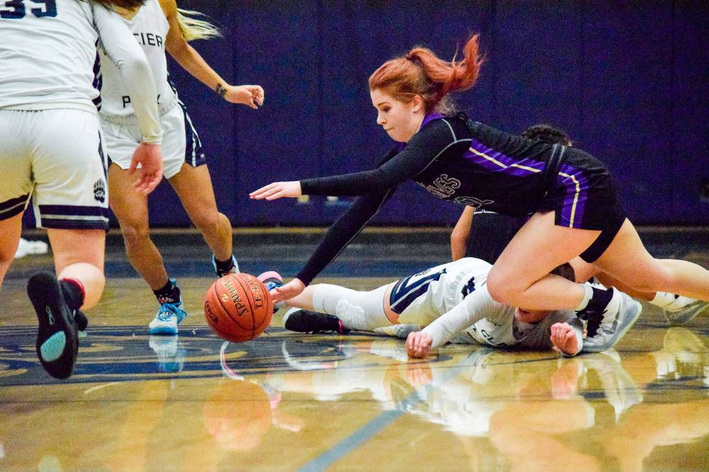 Lake Stevens Cori Wilcox dives for the ball against Glacier Peak on Tuesday, Jan. 28 at Glacier Peak High School in Snohomish. (Katie Webber / The Herald)