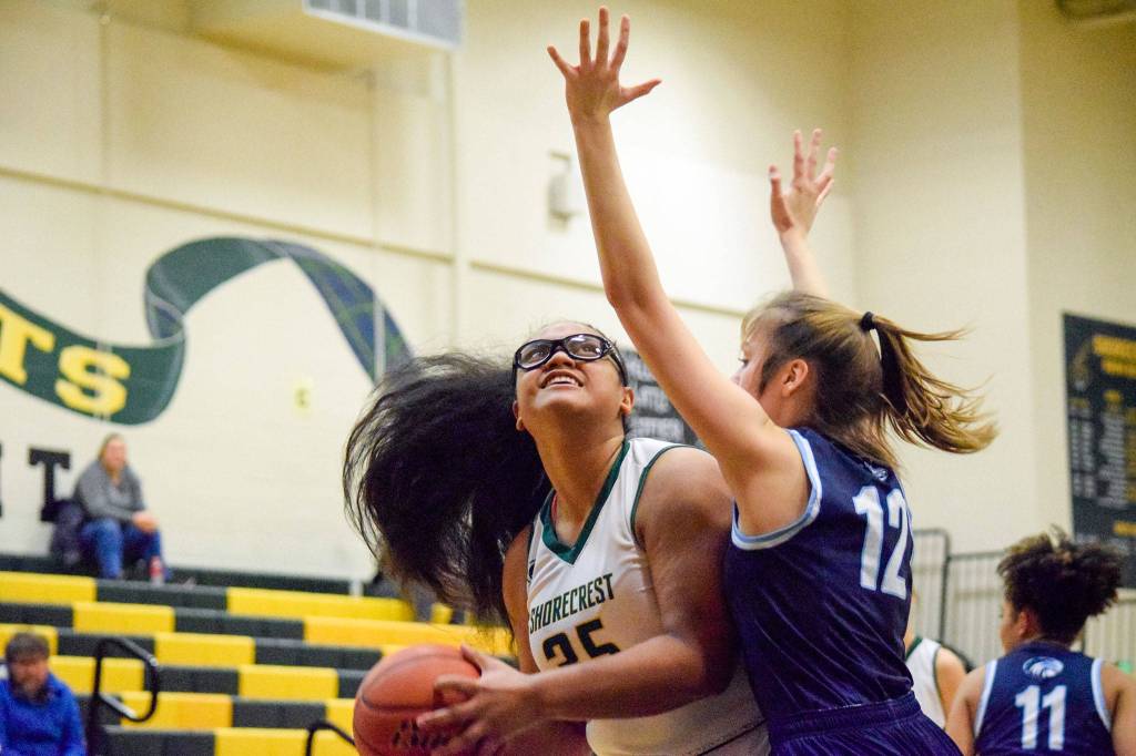 Shorecrests Kiana Lino looks up to shoot a basket against Meadowdales Maia Austvold (right) on Thursday, Jan. 30 at Shorecrest High School in Shoreline. (Katie Webber / The Herald)