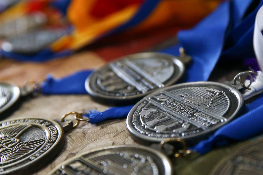 Ken Johnsons vast collection of placement medals in various sports including archery, swimming and track. (Kevin Clark / The Herald)