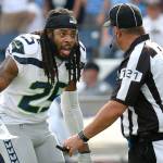 Former Seattle Seahawks cornerback Richard Sherman (25) argues a penalty call with umpire Paul King (121) during a game against the Tennessee Titans in 2017. (AP Photo/Mark Zaleski)
