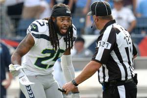 Former Seattle Seahawks cornerback Richard Sherman (25) argues a penalty call with umpire Paul King (121) during a game against the Tennessee Titans in 2017. (AP Photo/Mark Zaleski)