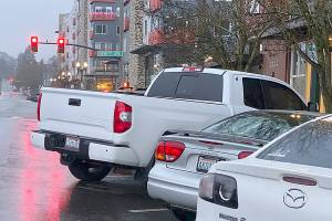 Is it legal for a vehicle to be longer than its parking spot?