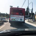 An Everett Transit bus on 41st Street waits for the traffic signal at the intersection with Rucker Avenue. The bus stop is on the far side of the intersection. (Sue Misao / The Herald)