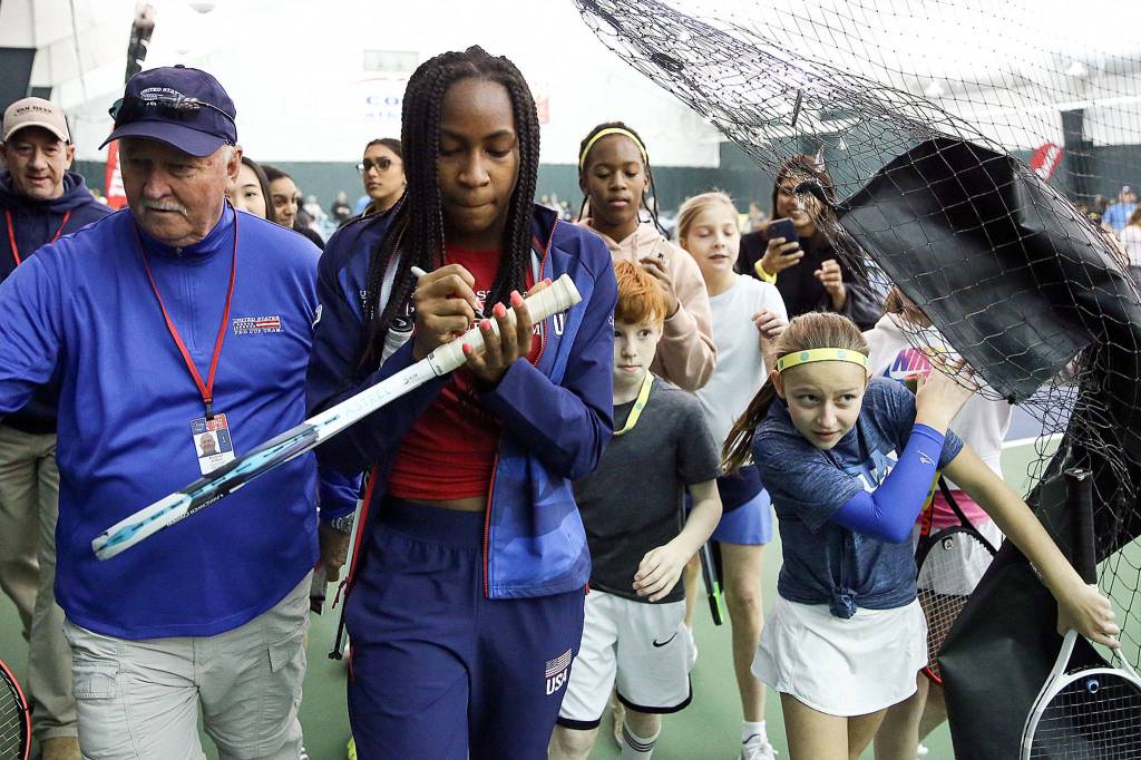 Coco Gauff signs an autograph during Net Generation Kids Day on Tuesday afternoon at Columbia Athletic Club in Everett. (Kevin Clark / The Herald)