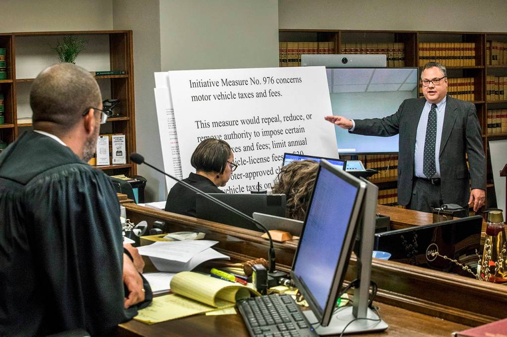 Attorney David Hackett speaks to Judge Marshall Ferguson in King County Court on Friday in Seattle, during the car-tab initiative 976 hearing which the city and others are suing to stop. (Steve Ringman/The Seattle Times via AP)