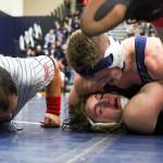 Glacier Peaks Dylan Owen (top) works to pin Sean Sanchez of Lake Stevens in the 170-pound final at the 4A Region 1 Tournament Saturday afternoon at Glacier Peak High School in Snohomish. Owen won by pinfall. (Kevin Clark / The Herald)