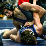 Lake Stevens Tyler Fouts works against Graham-Kapowsins Kai Calhoun in the 120-pound final at the 4A Region 1 Tournament Saturday afternoon at Glacier Peak High School in Snohomish. Fouts won by major decision to help lead Lake Stevens to the regional team championship. (Kevin Clark / The Herald)