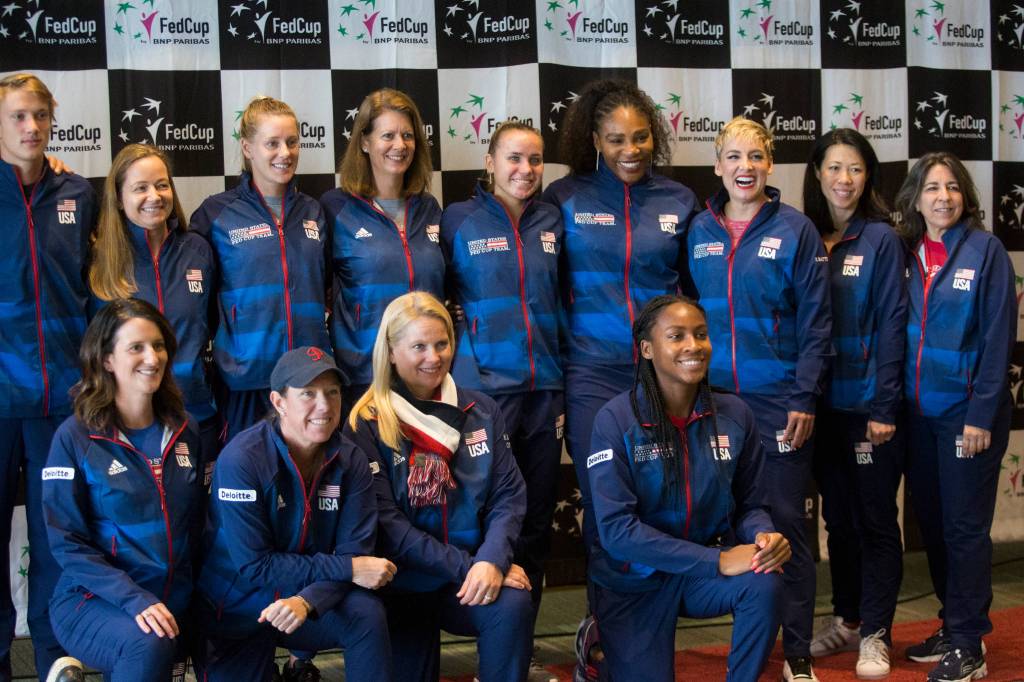 Unite States team members and support staff pose for a group photo Thursday after the official draw ceremony for the Fed Cup event taking place this weekend at Angel of the Winds Arena in Everett. (Andy Bronson / The Herald)