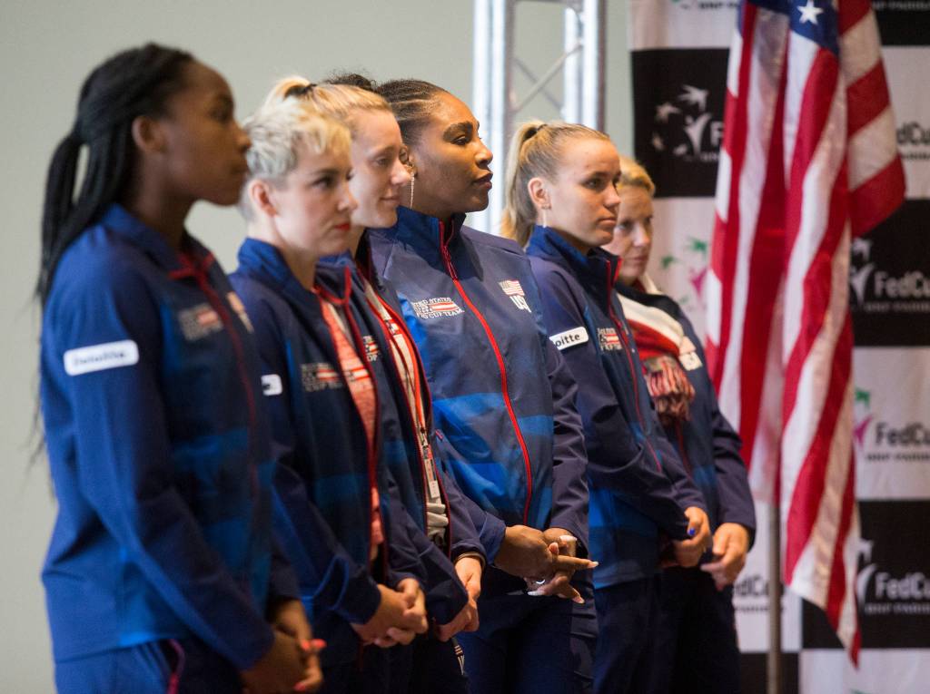 Members of Team USA watch as matches are set at the official draw ceremony Thursday for the Fed Cup event this weekend at Angel of the Winds Arena in Everett. (Andy Bronson / The Herald)