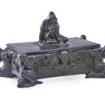 Recycling is not new. Attractive boxes that held products like cigars were often reused to hold jewelry or sewing equipment. What the hooded figures on this box represent is unknown, but the box sold for $875 to be used in a 21st-century way.